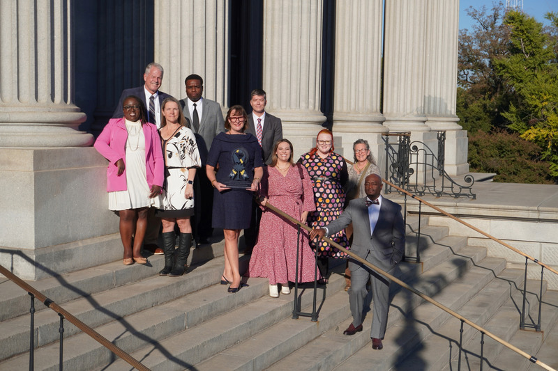 Aiken team outside on steps of SC State Building.