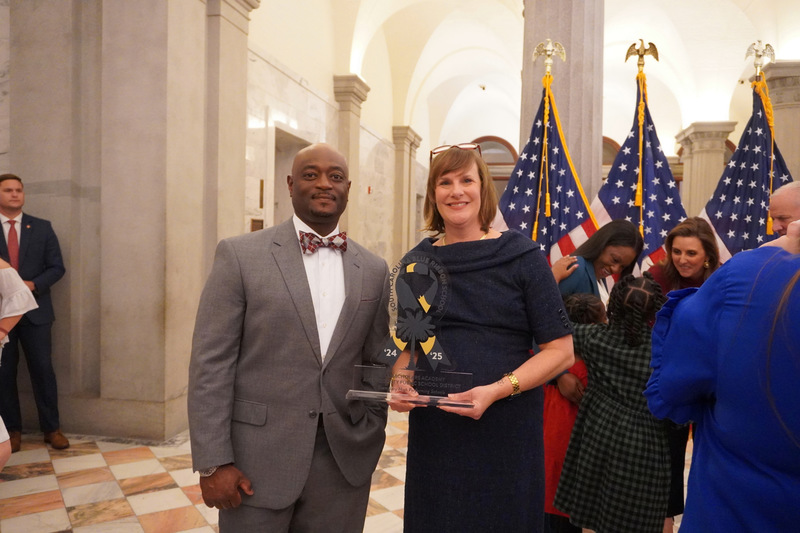 Superintendent and ASA principal receiving award for Blue Ribbon School.