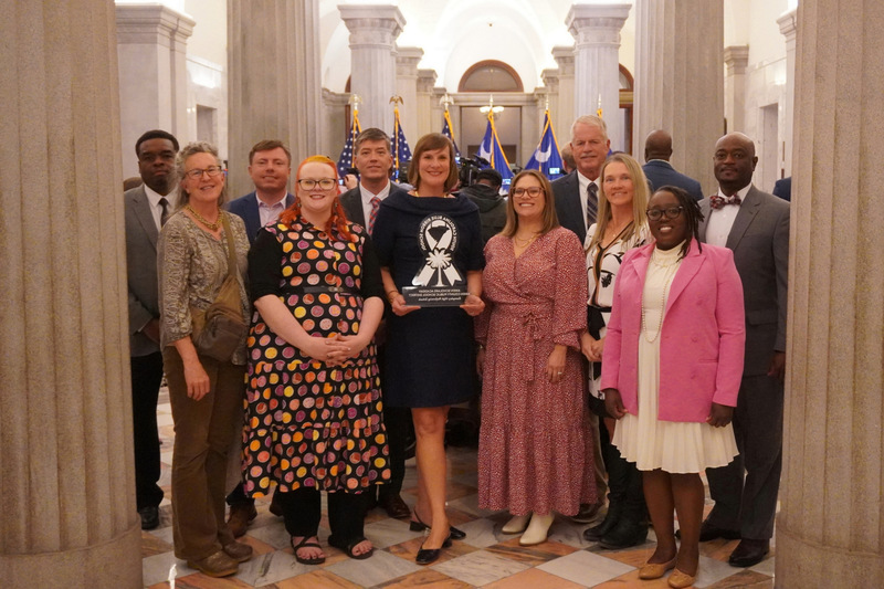 Aiken team grouped after receiving award.