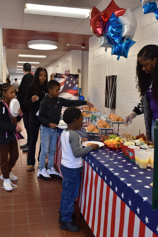 Families getting breakfast.