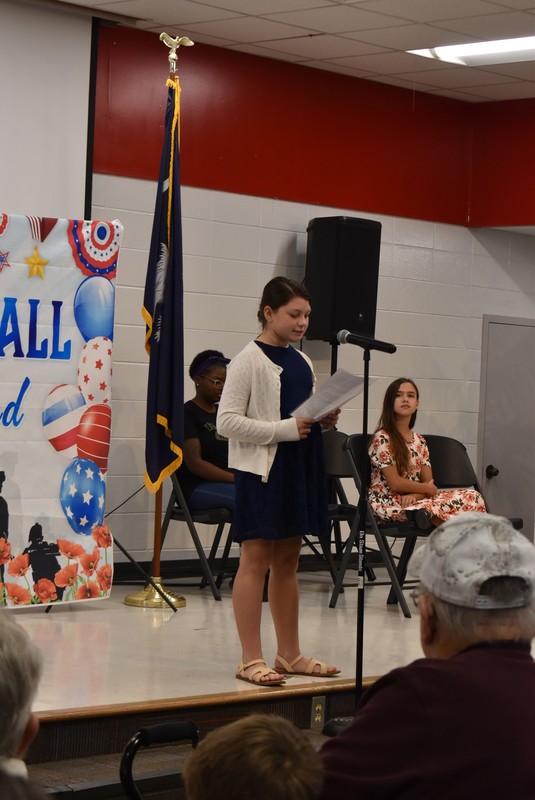 Student presenting to crowd.