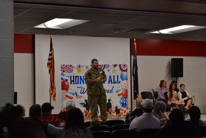 Speaker addressing crowd.