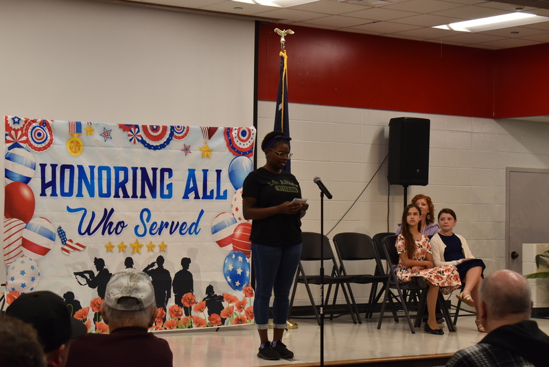 Speaker addressing crowd.