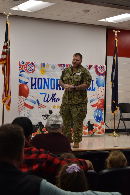 Speaker addressing crowd.