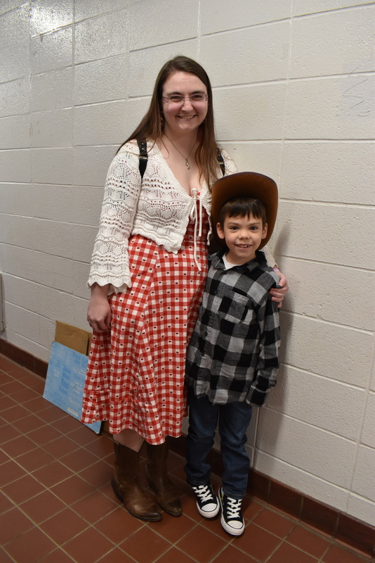 Families at rodeo dance.