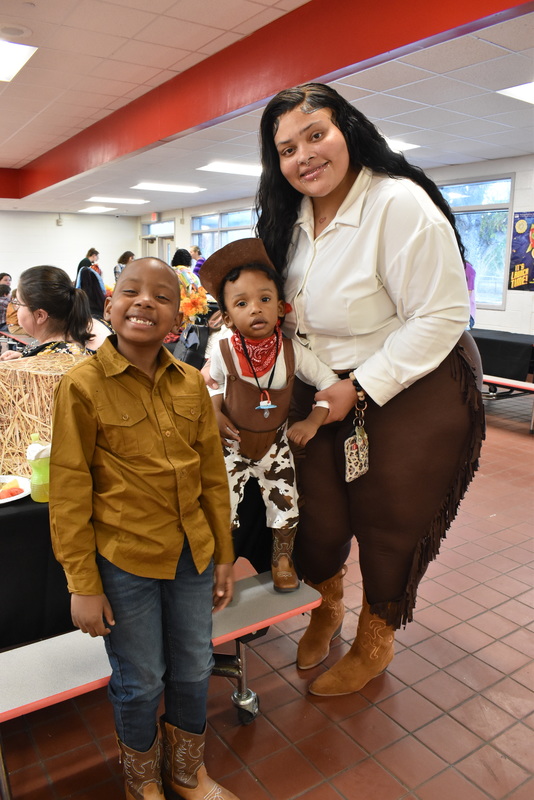 Families at rodeo dance.