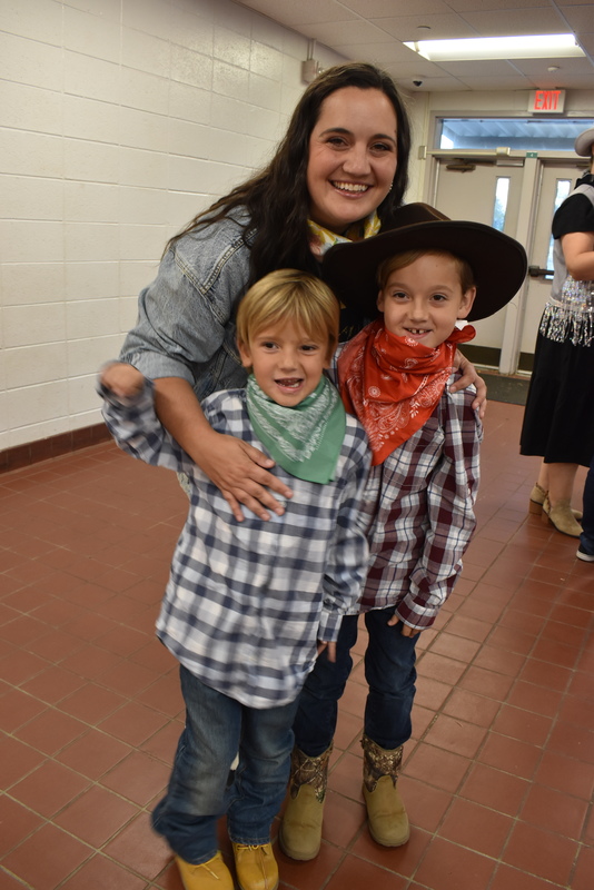 Families at rodeo dance.