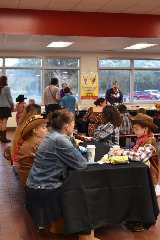 Families at rodeo dance.