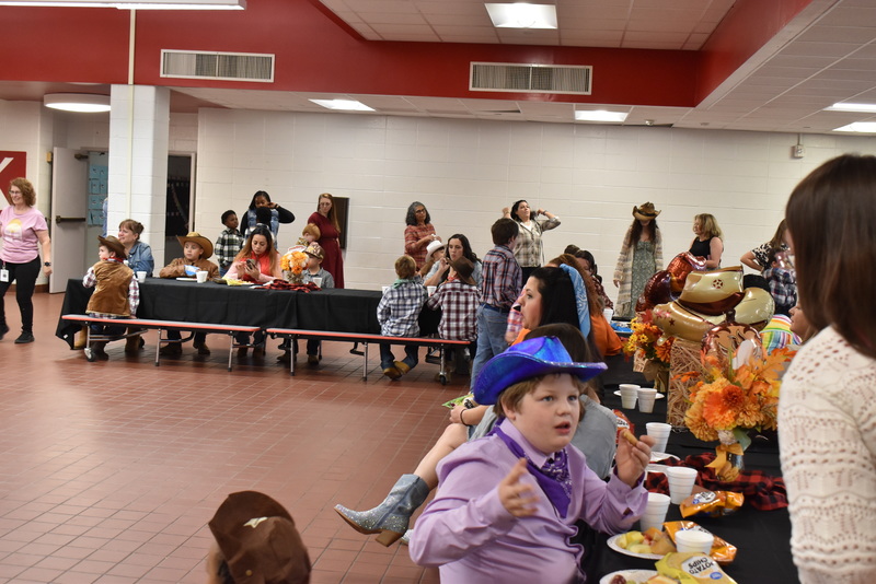Families at rodeo dance.