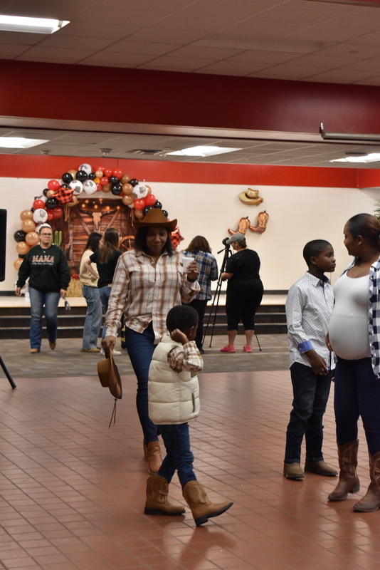 Families at rodeo dance.