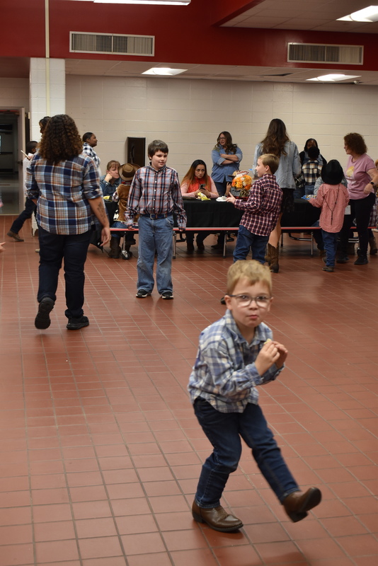 Families at rodeo dance.