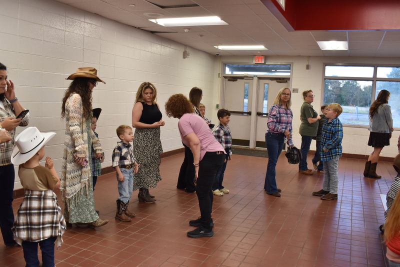 Families at rodeo dance.