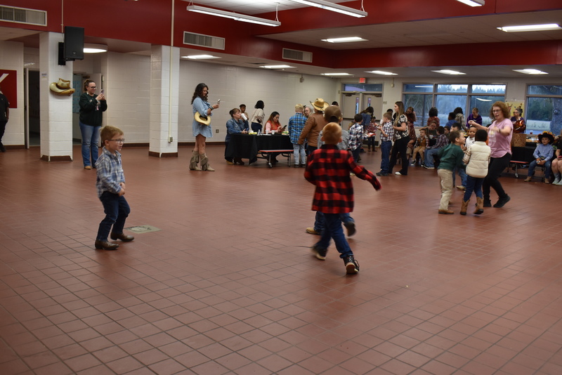 Families at rodeo dance.