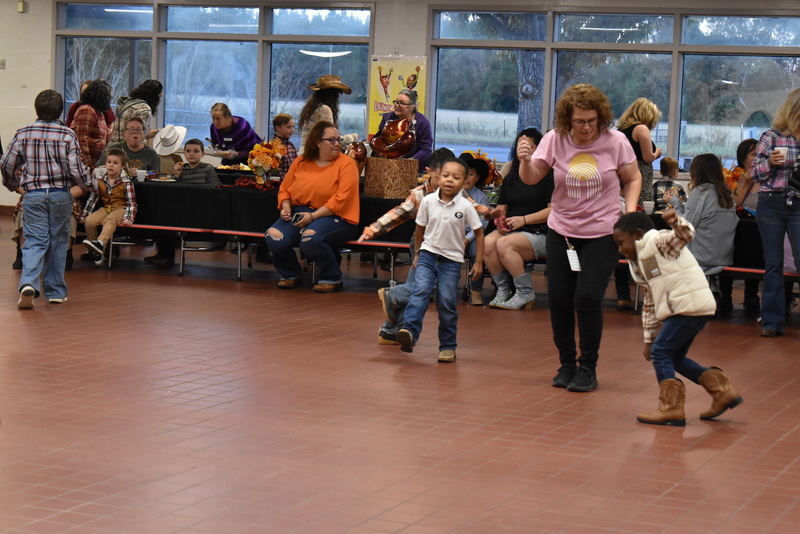 Families at rodeo dance.