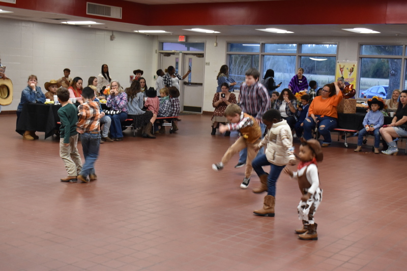 Families at rodeo dance.