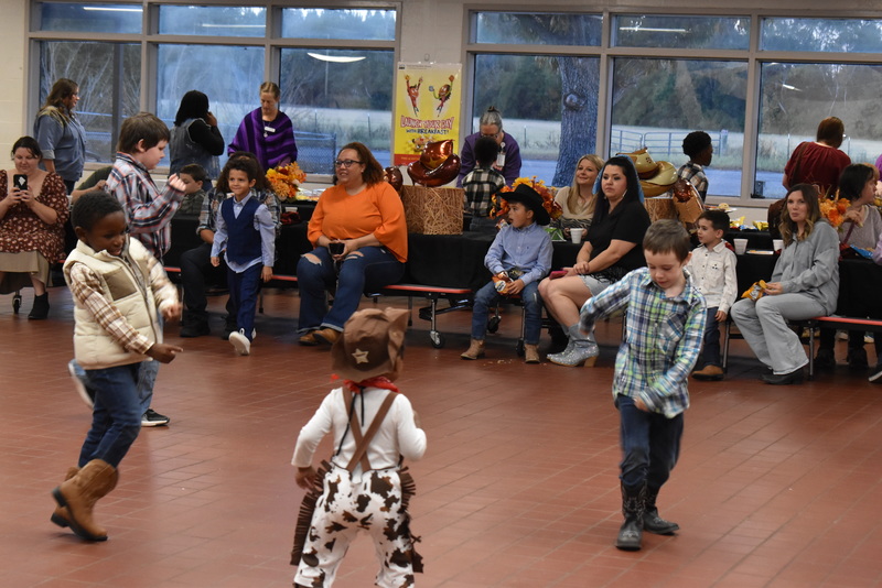 Families at rodeo dance.