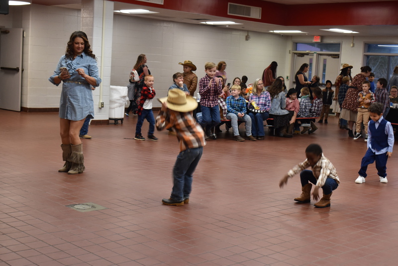 Families at rodeo dance.