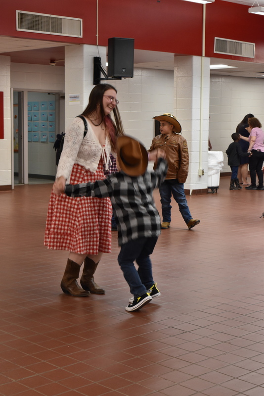 Families at rodeo dance.