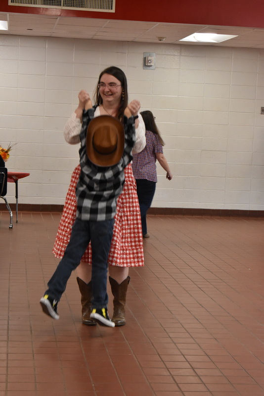 Families at rodeo dance.