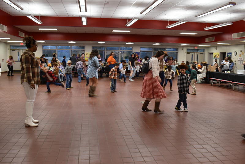 Families at rodeo dance.
