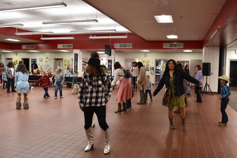 Families at rodeo dance.