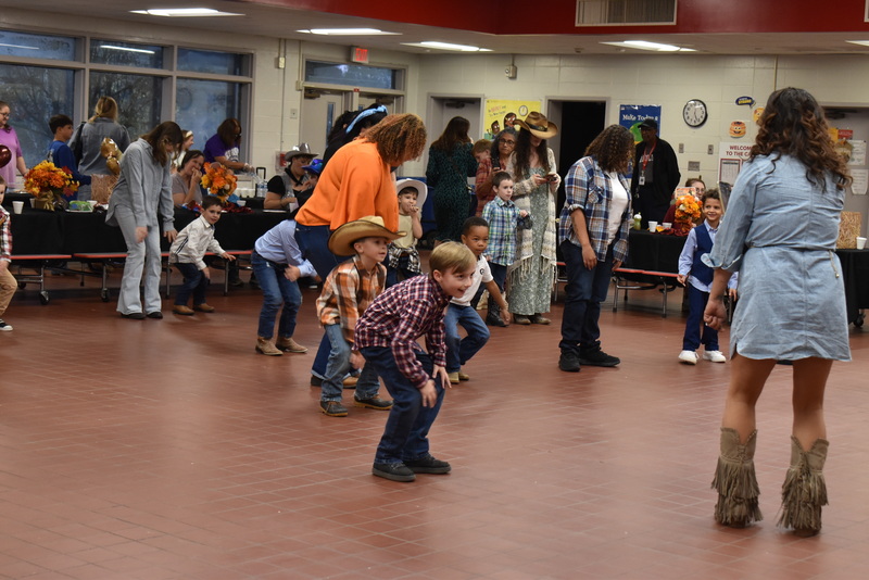 Families at rodeo dance.