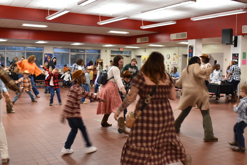 Families at rodeo dance.