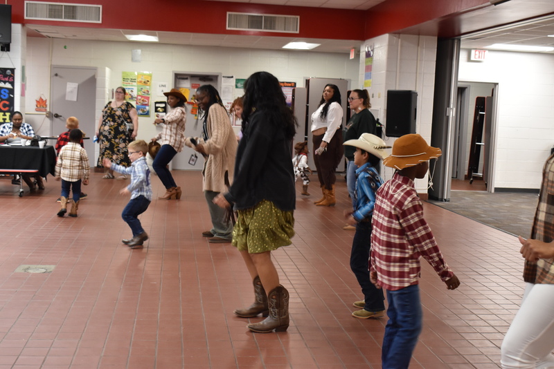 Families at rodeo dance.