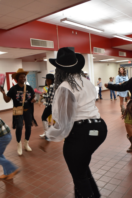 Families at rodeo dance.