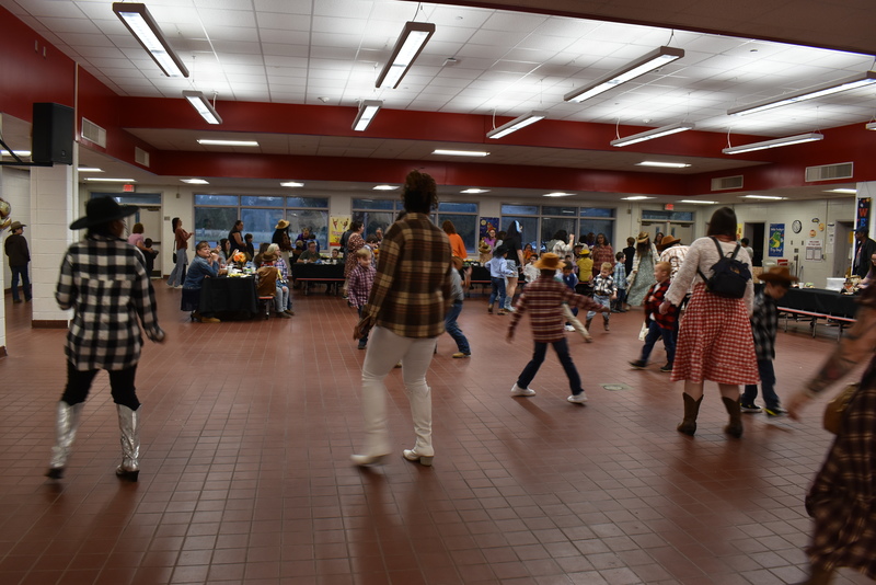 Families at rodeo dance.