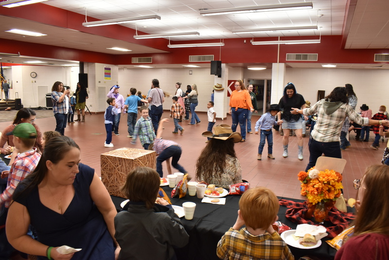 Families at rodeo dance.