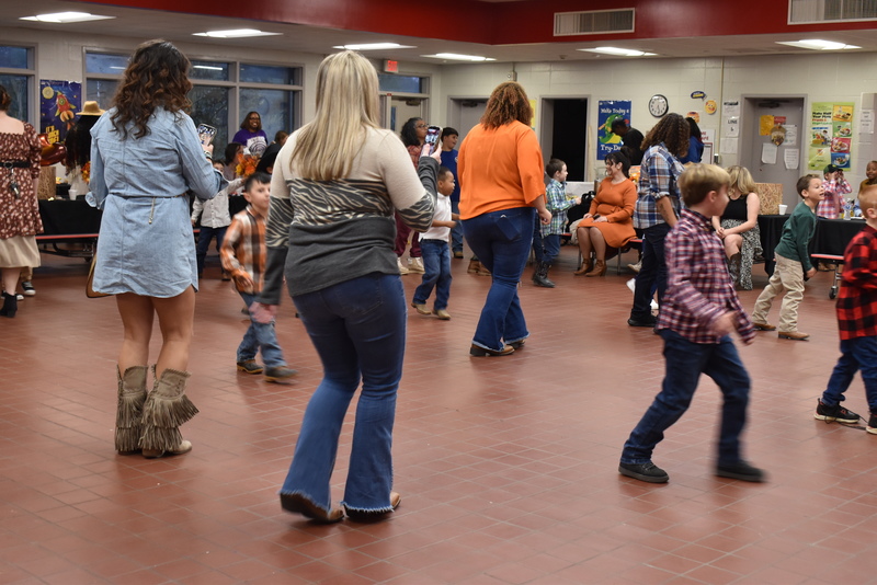 Families at rodeo dance.