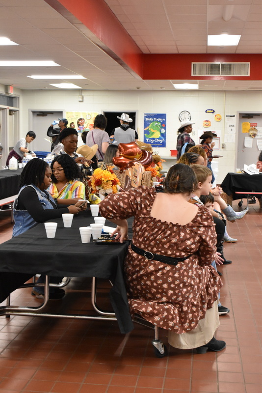 Families at rodeo dance.