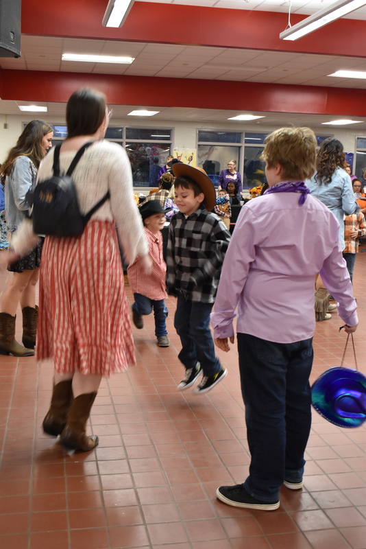 Families at rodeo dance.