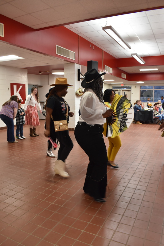 Families at rodeo dance.