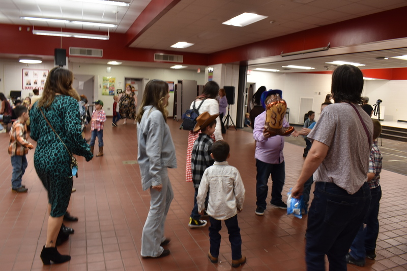 Families at rodeo dance.