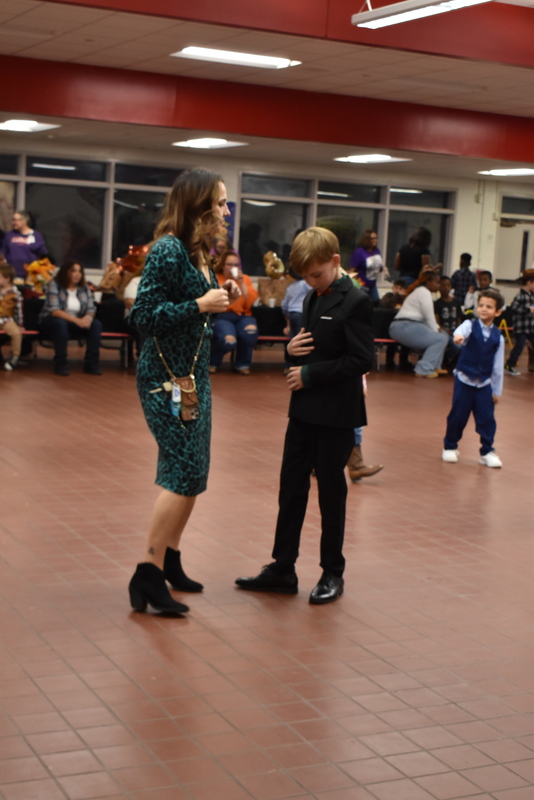Families at rodeo dance.