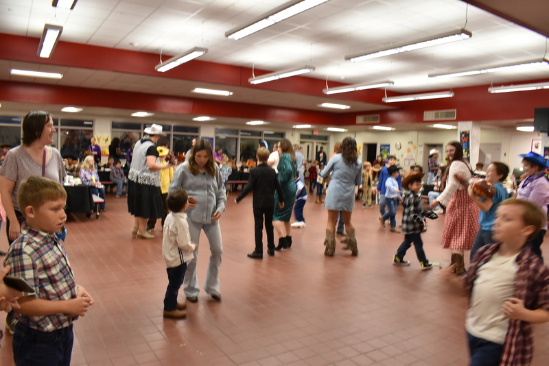 Families at rodeo dance.