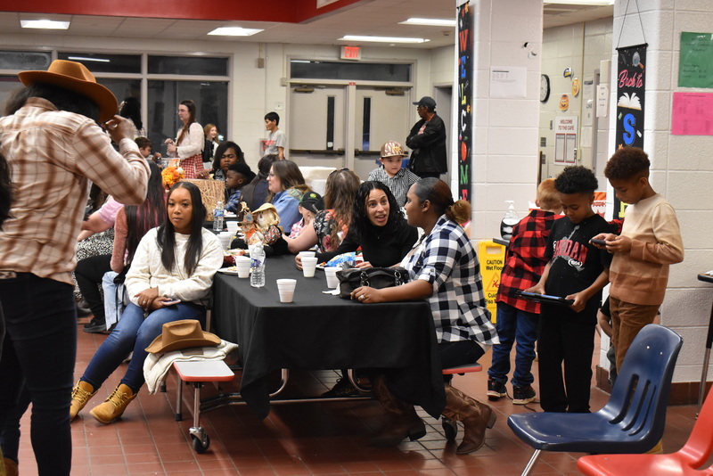 Families at rodeo dance.