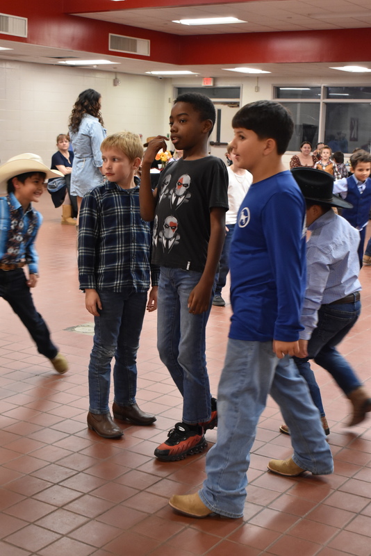 Families at rodeo dance.
