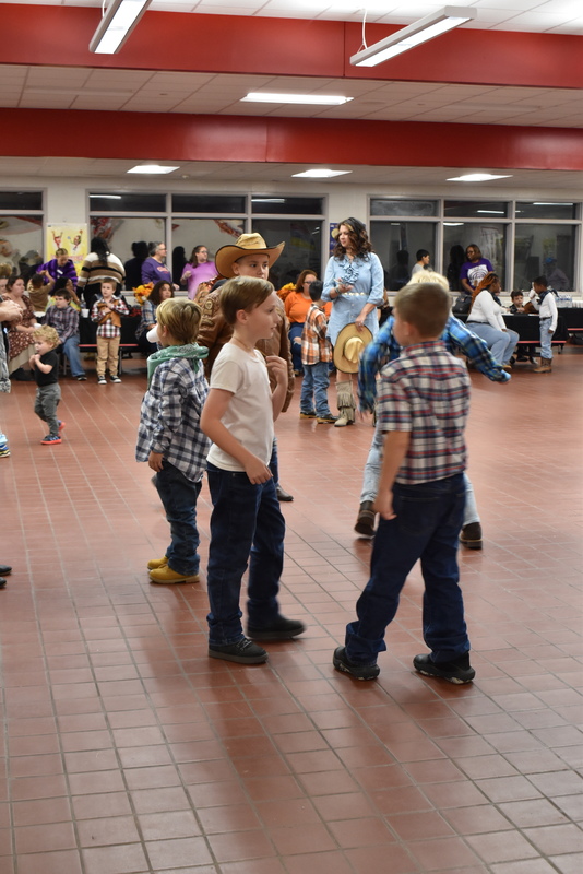 Families at rodeo dance.