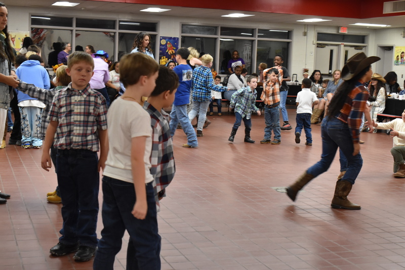 Families at rodeo dance.