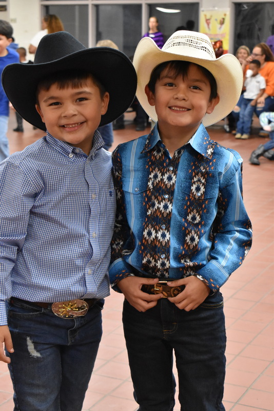 Families at rodeo dance.