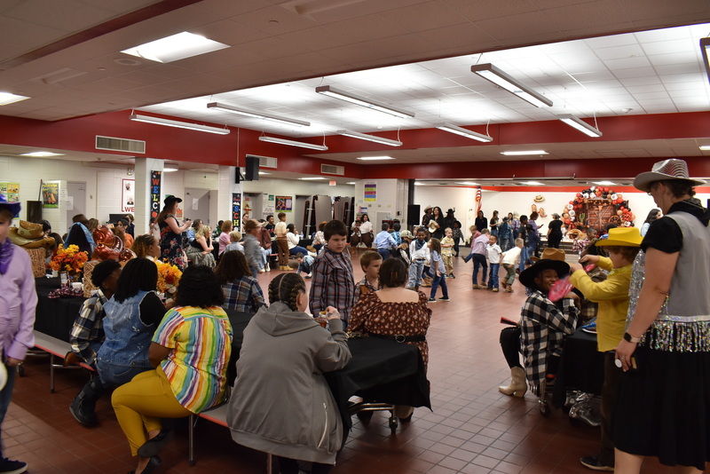 Families at rodeo dance.