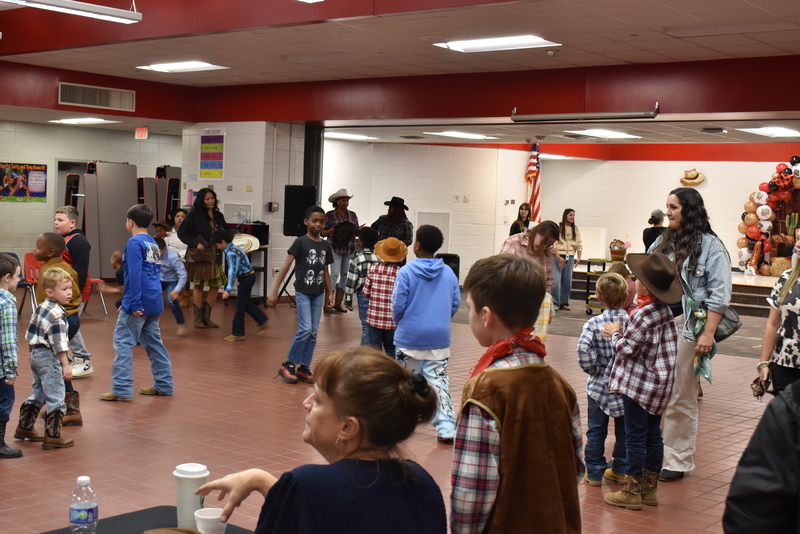 Families at rodeo dance.