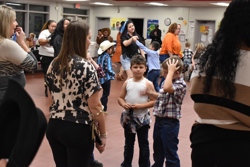 Families at rodeo dance.