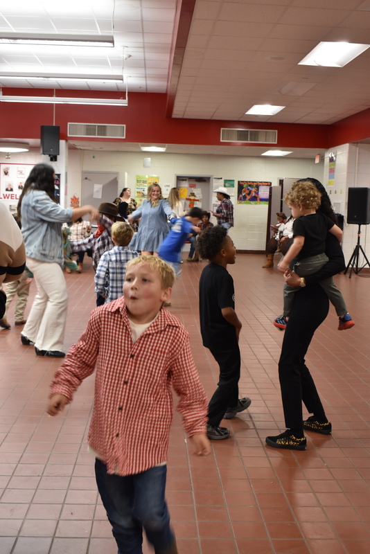 Families at rodeo dance.