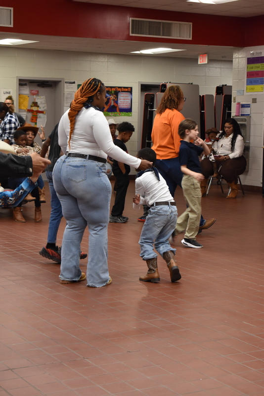 Families at rodeo dance.