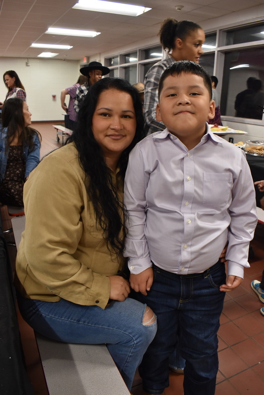 Families at rodeo dance.