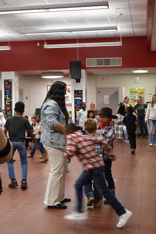 Families at rodeo dance.
